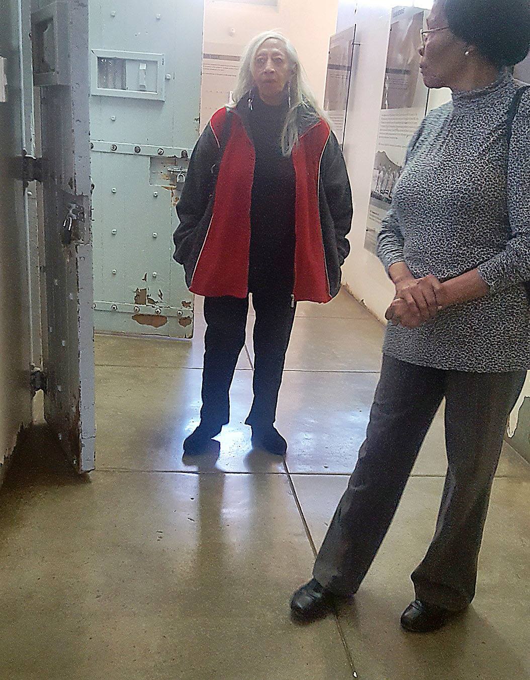 Juby Mayet and Cecilie Palmer standing in front of cells in Constitution Hill women's prison