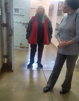 Juby Mayet and Cecilie Palmer standing in front of cells in Constitution Hill women's prison